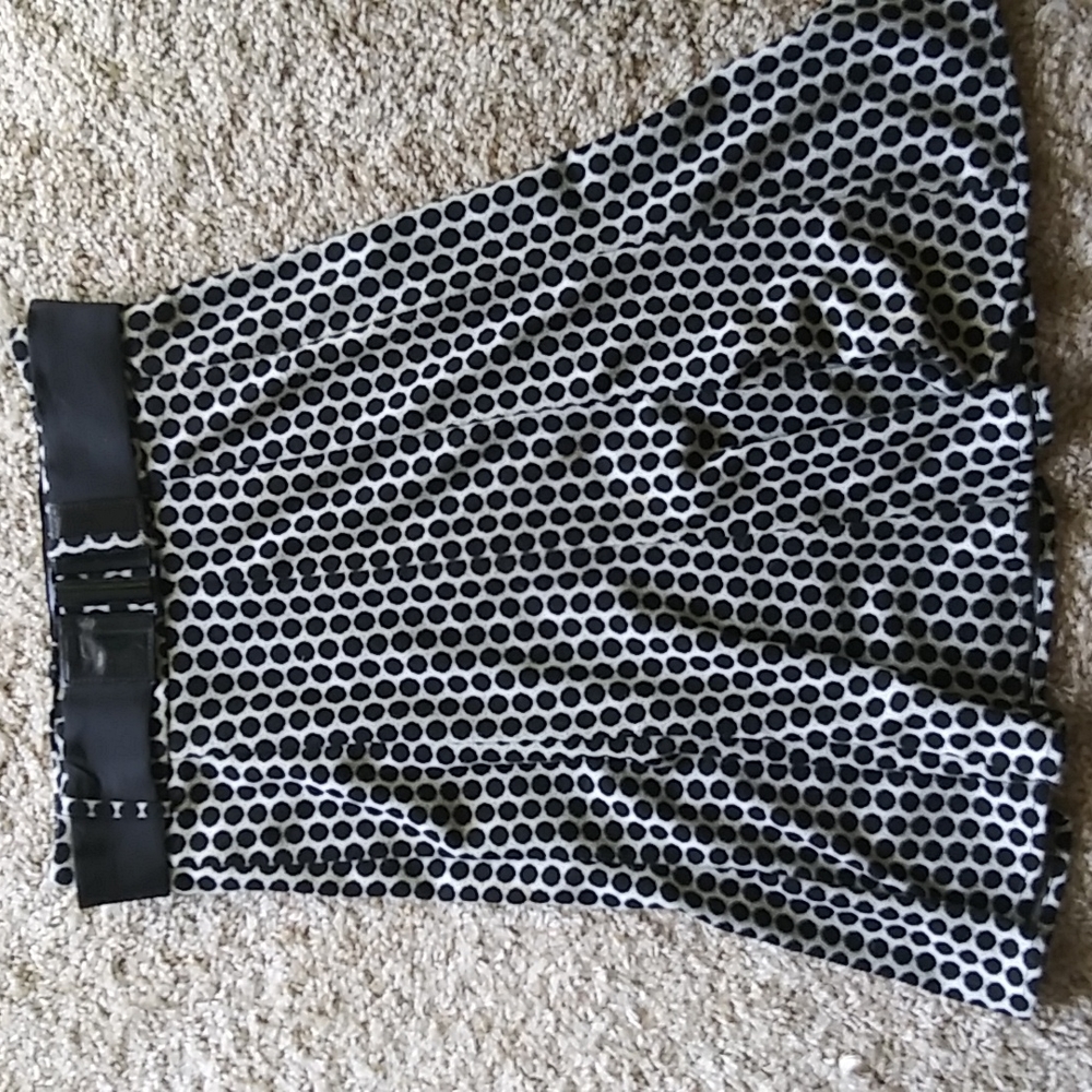 Black and white polka-dotted knee length skirt